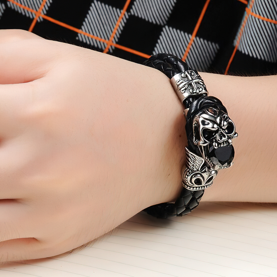 Stylish men's black PU leather bracelet with skull charm and vintage stainless steel accents.