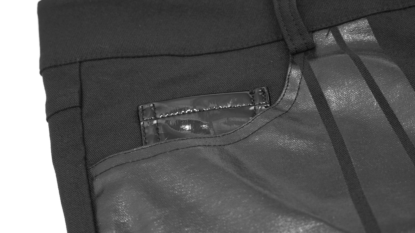 Close-up of men's cyberpunk style black pants, featuring stylish spliced stripes and a sleek pocket design.