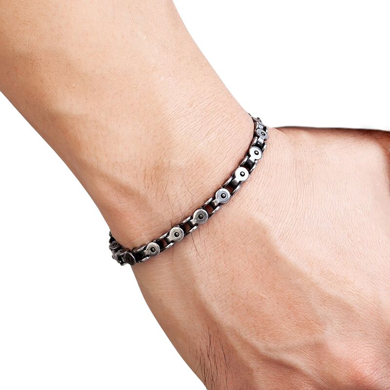 Stylish men's dark gray stainless steel punk bracelet worn on wrist, featuring unique cross designs for a trendy look.