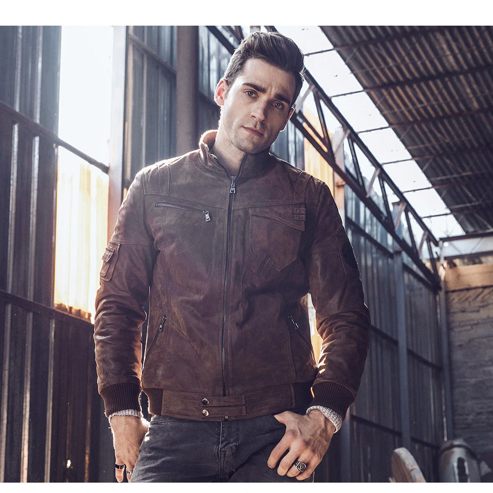 Men's vintage style leather jacket with silver zippers, perfect for motorcycle enthusiasts and alternative fashion lovers.