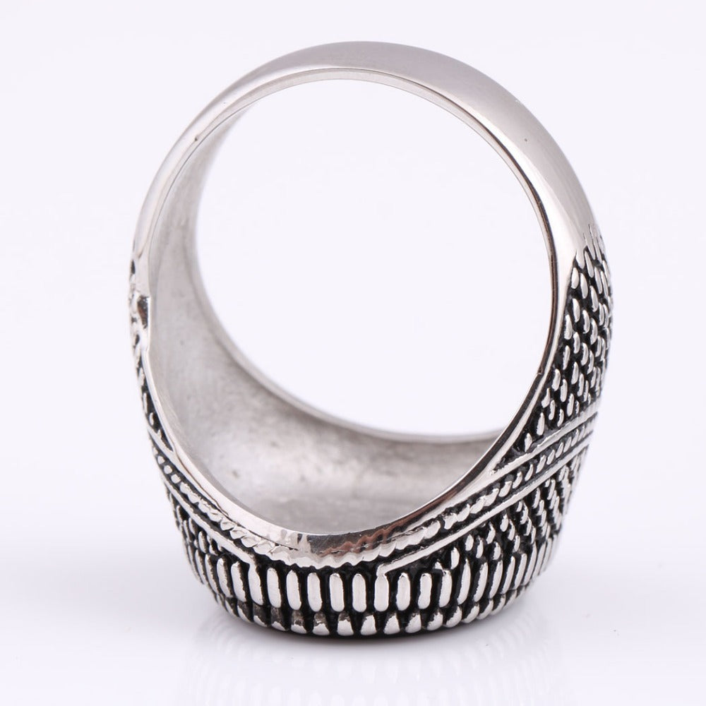 Vintage silver-plated men's ring with detailed design and black stone interior, made of hypoallergenic stainless steel.