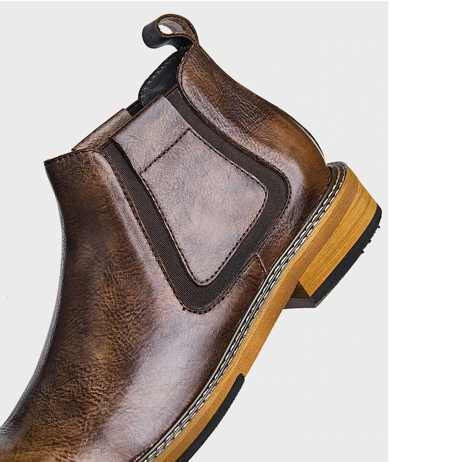 Stylish men's soft leather ankle boot in brown with modern design and comfortable sole.