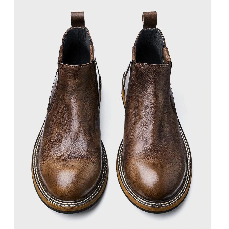 Stylish men's soft leather ankle boots, casual round toe design, perfect for modern fashion and comfort.