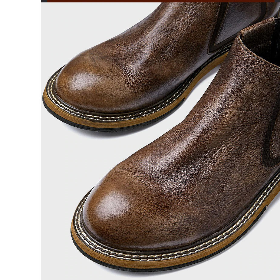 Men's brown leather ankle boots with round toe and stylish design for casual wear.