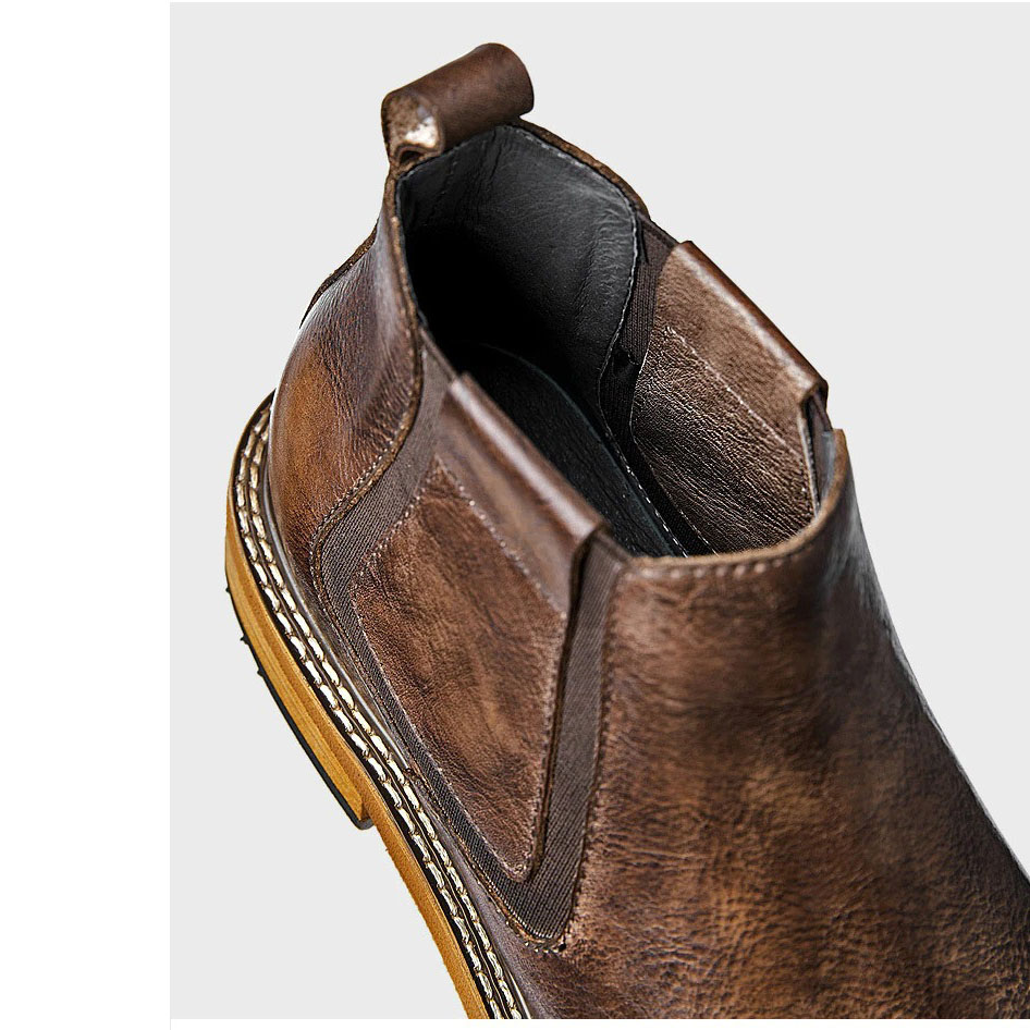 Close-up of a men's brown soft leather ankle boot showcasing the round toe design and modern finish.