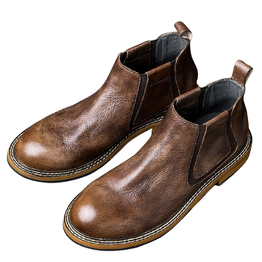 Men's soft leather ankle boots in brown, featuring a round toe and modern casual style for versatile fashion.