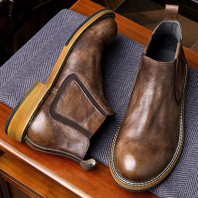 Men's soft leather ankle boots in brown, casual round toe design, perfect for modern fashion enthusiasts.
