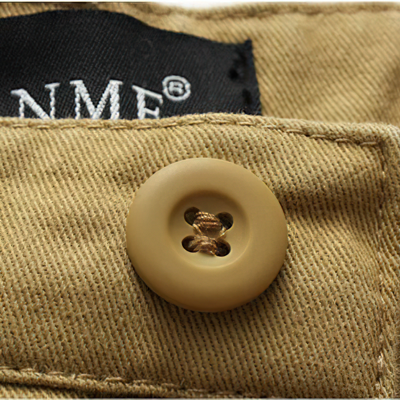 Close-up of a stylish button on men's solid cargo shorts, showcasing quality craftsmanship and attention to detail.