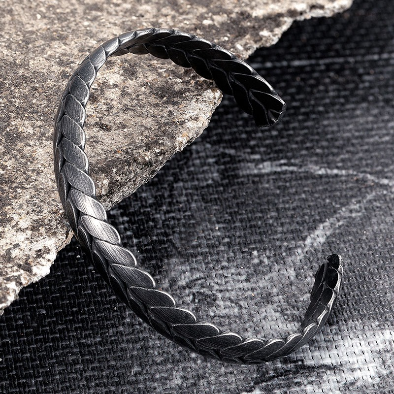 Men's black vintage stainless steel bracelet with a braided design, perfect for rock style outfits.