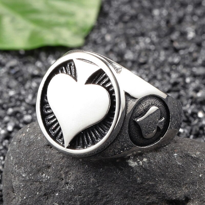 Men's stainless steel ring featuring a heart design, perfect for rock style jewelry enthusiasts.