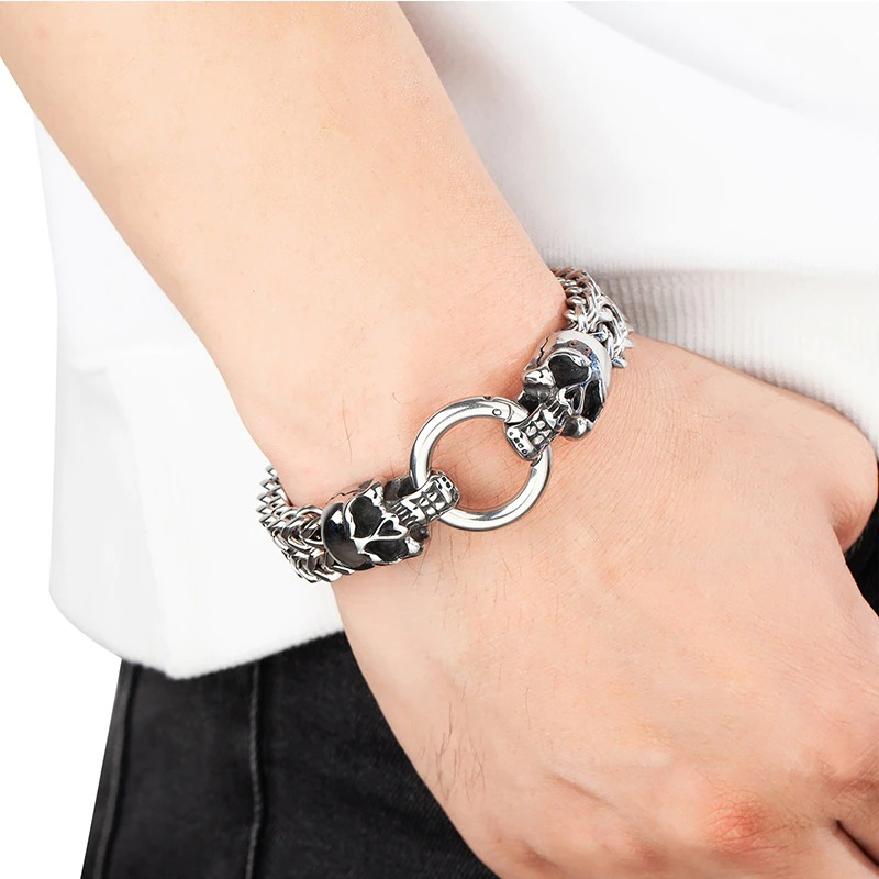 Men's stainless steel skull bracelet featuring a unique skull lock, perfect for punk jewelry enthusiasts.