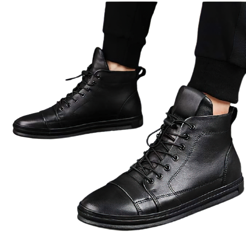 Men's stylish black leather ankle boots with flexible soles for comfort and casual style.