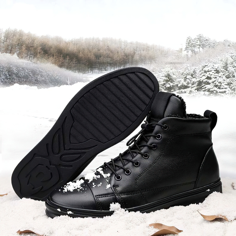 Men's black leather ankle boots with fur, perfect for winter, offering style and warmth on snowy terrain.