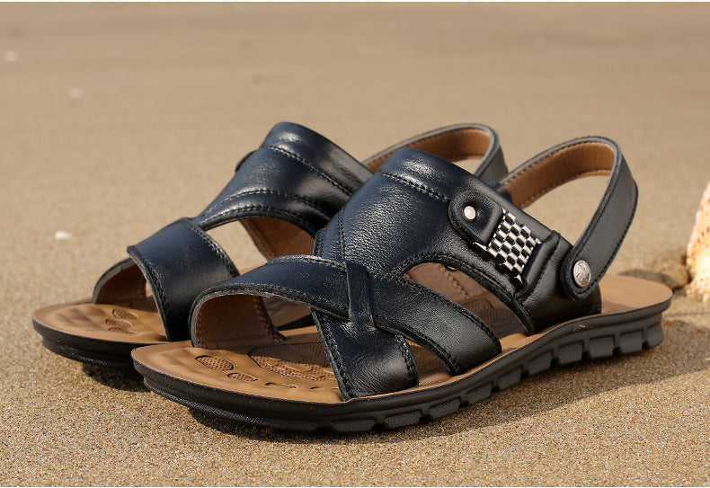 Men's summer leather sandals in black on sandy beach; breathable, waterproof, non-slip for casual outfits.