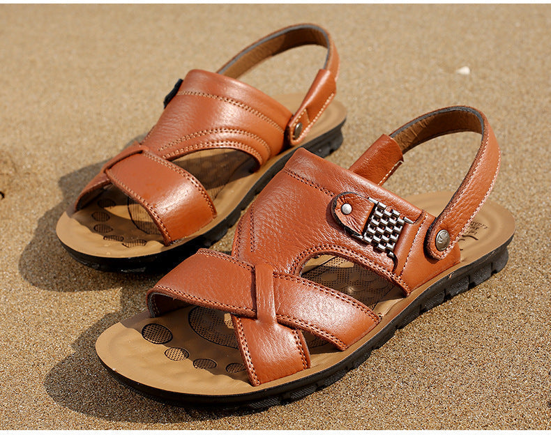 Men's summer leather sandals on sandy beach, stylish and breathable slip-on casual shoes for aesthetic outfits.