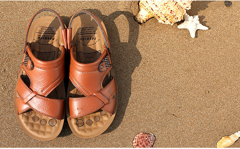 Men's summer leather sandals on sandy beach, perfect for casual outfits and cozy summer vibes.