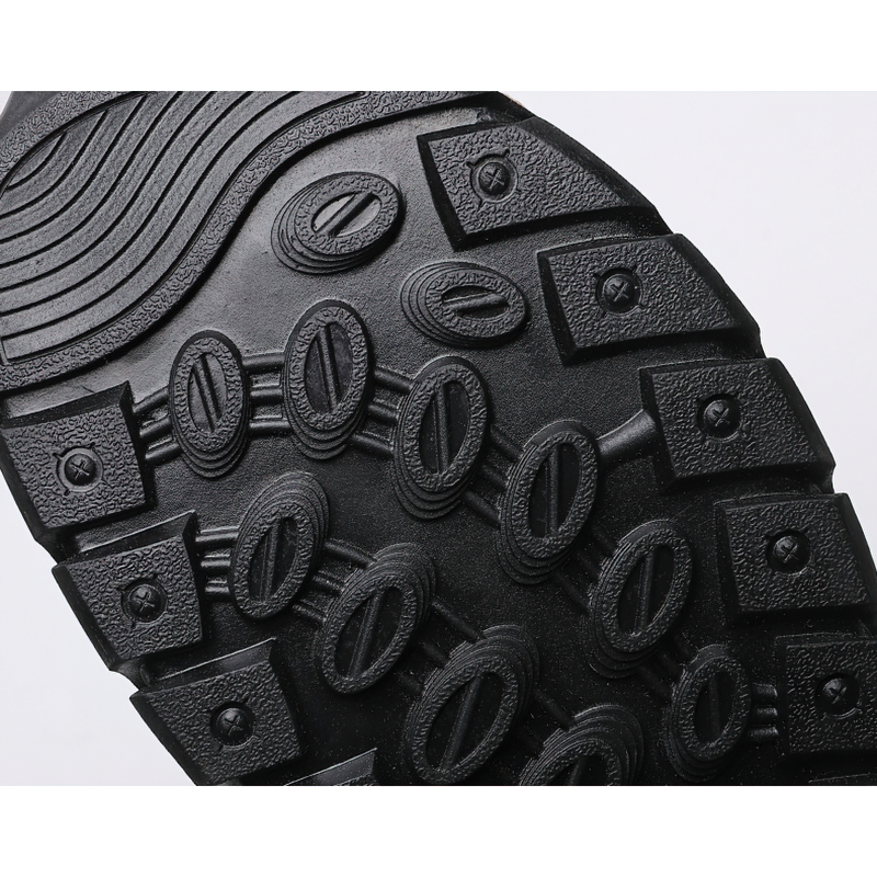 Close-up of the non-slip wear-resistant outsole of men's summer leather sandals, showcasing tread design for traction.