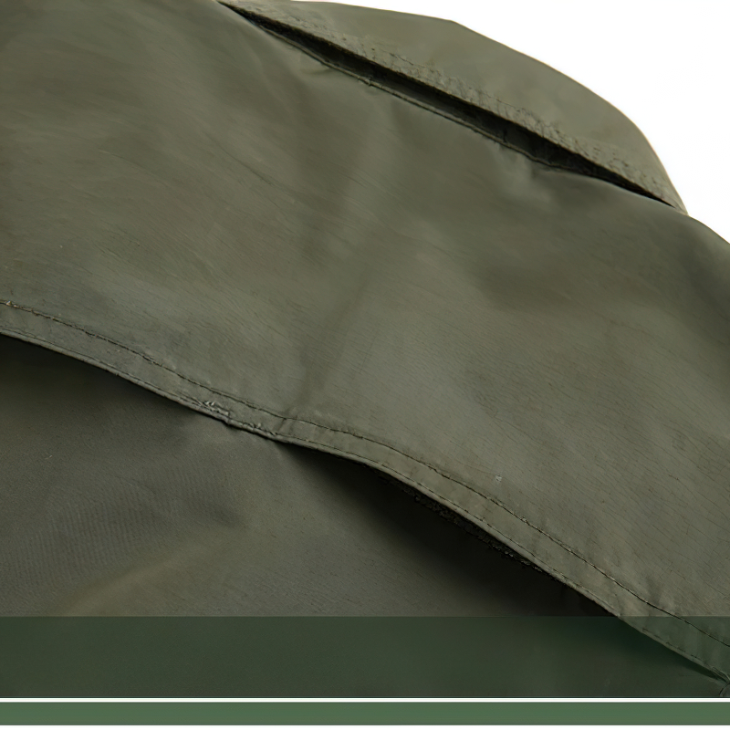 Close-up of olive green tactical fabric showing water-resistant texture and durable stitching for outdoor activities.