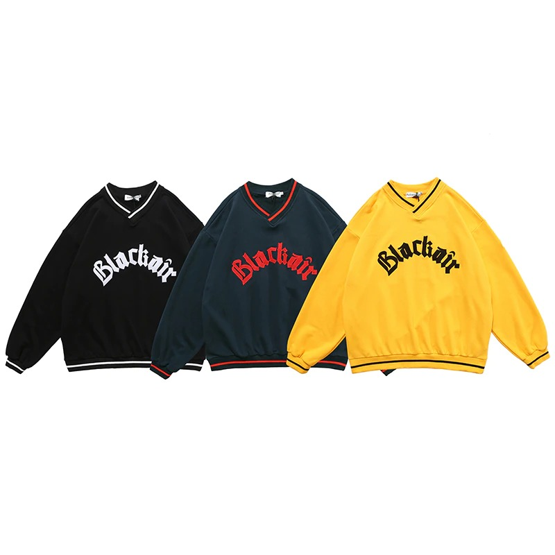 Men's oversized V-neck sweatshirts in black, green, and yellow with trendy letter patch designs.