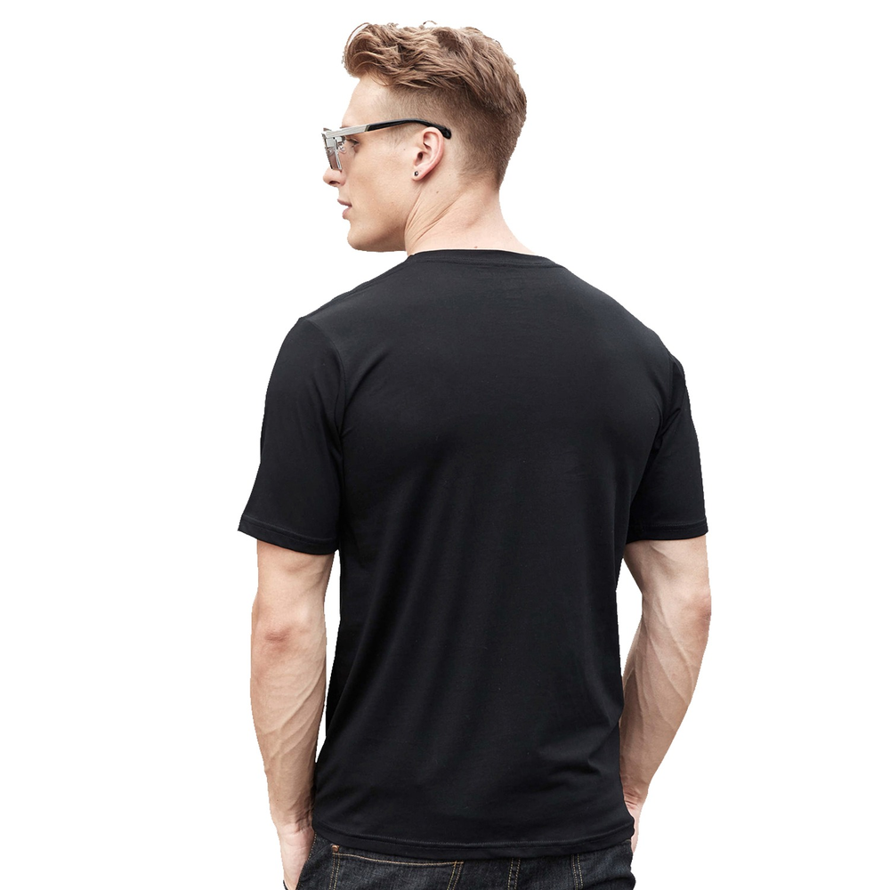 Model wearing the back view of a Men's Vintage Cotton T-Shirt in black, showcasing a rock style look.