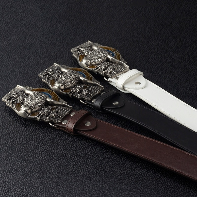 Men's vintage cowskin belts in black, brown, and white with unique bull head buckles, showcasing genuine leather craftsmanship.