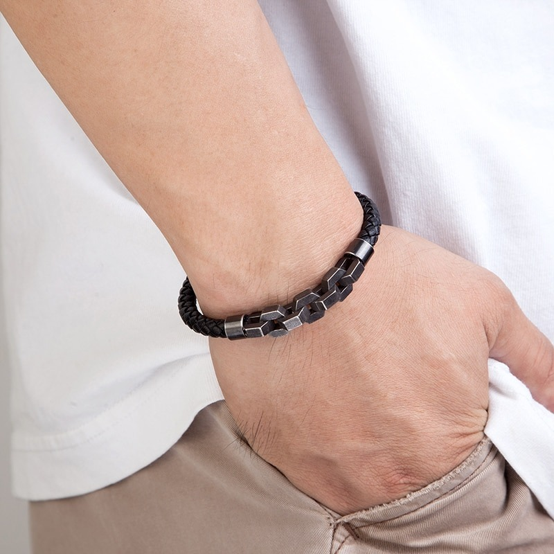 Men's vintage genuine leather bracelet, rock style accessory worn on wrist, with stylish stainless steel accents.