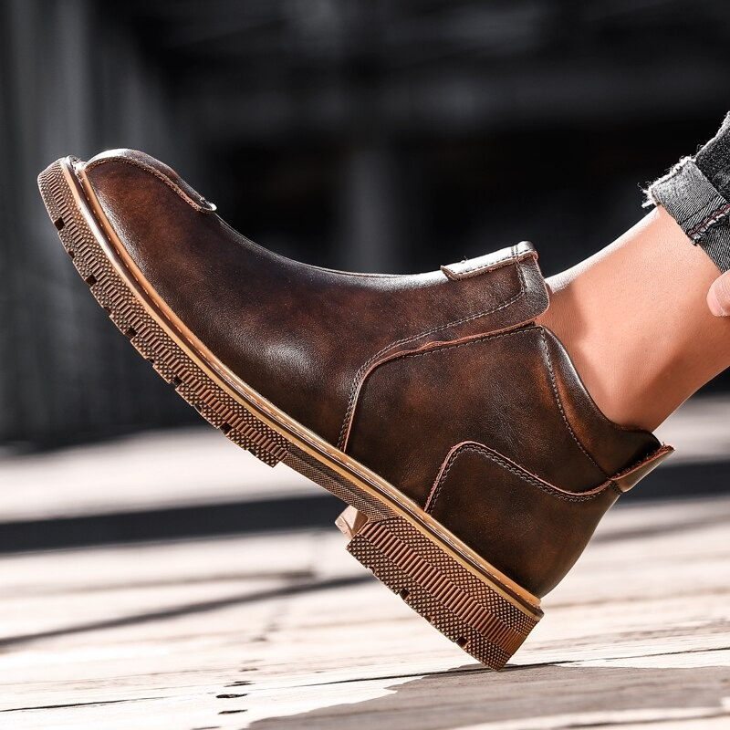 Men's stylish brown ankle boots made of genuine leather, perfect for casual wear and comfort.