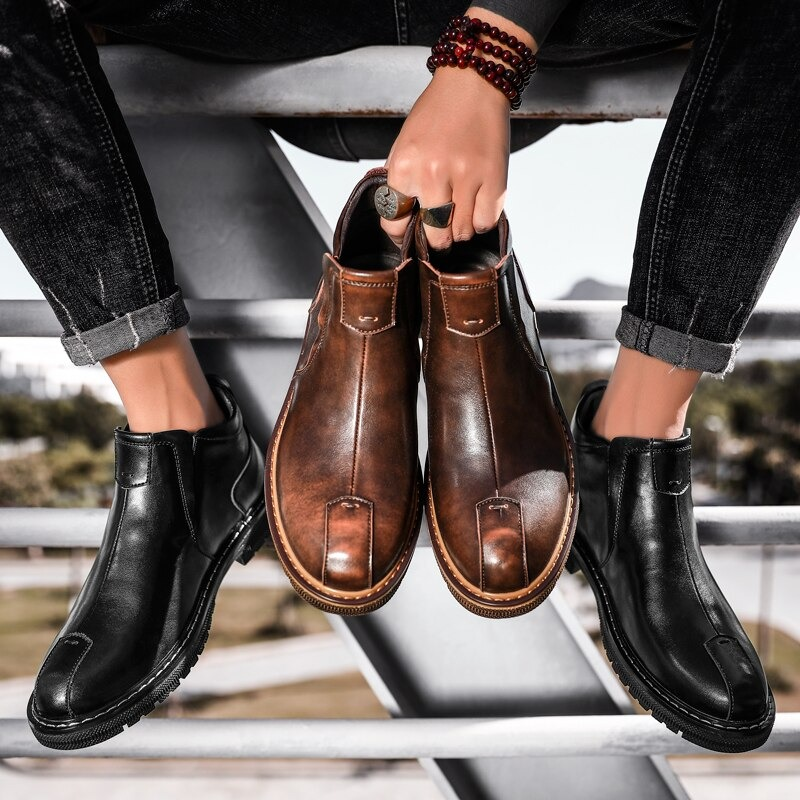 Men's warm ankle boots in black and brown leather, showcasing stylish comfort and modern design.