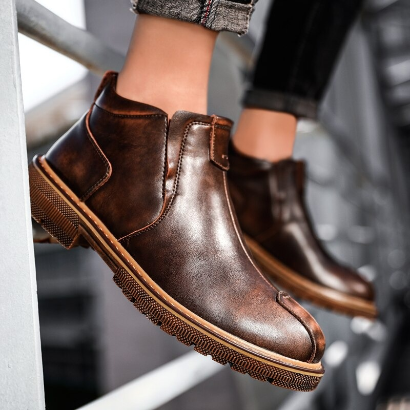 Men's warm ankle boots in brown leather, perfect for casual style and comfort, showcased from a stylish angle.