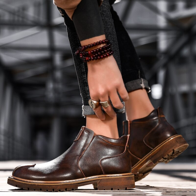 Stylish men's brown leather ankle boots, perfect for casual wear, offering comfort and modern design.