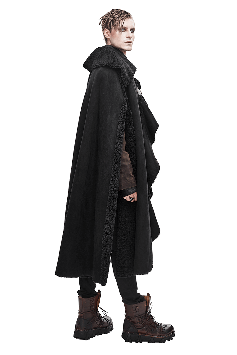 Men's gothic asymmetrical black cloak with buckled straps, stylishly worn by a model in edgy boots.