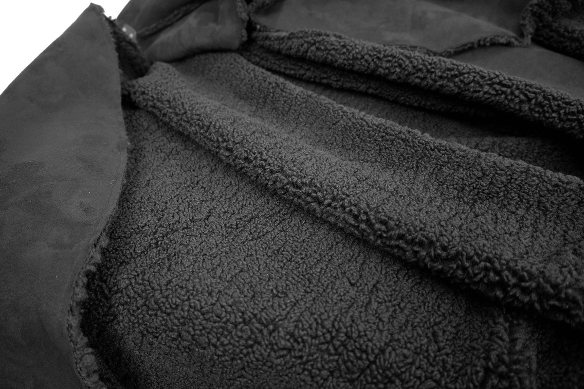 Close-up of the soft, plush interior of a men's gothic cloak, showcasing cozy black fabric details for warmth.