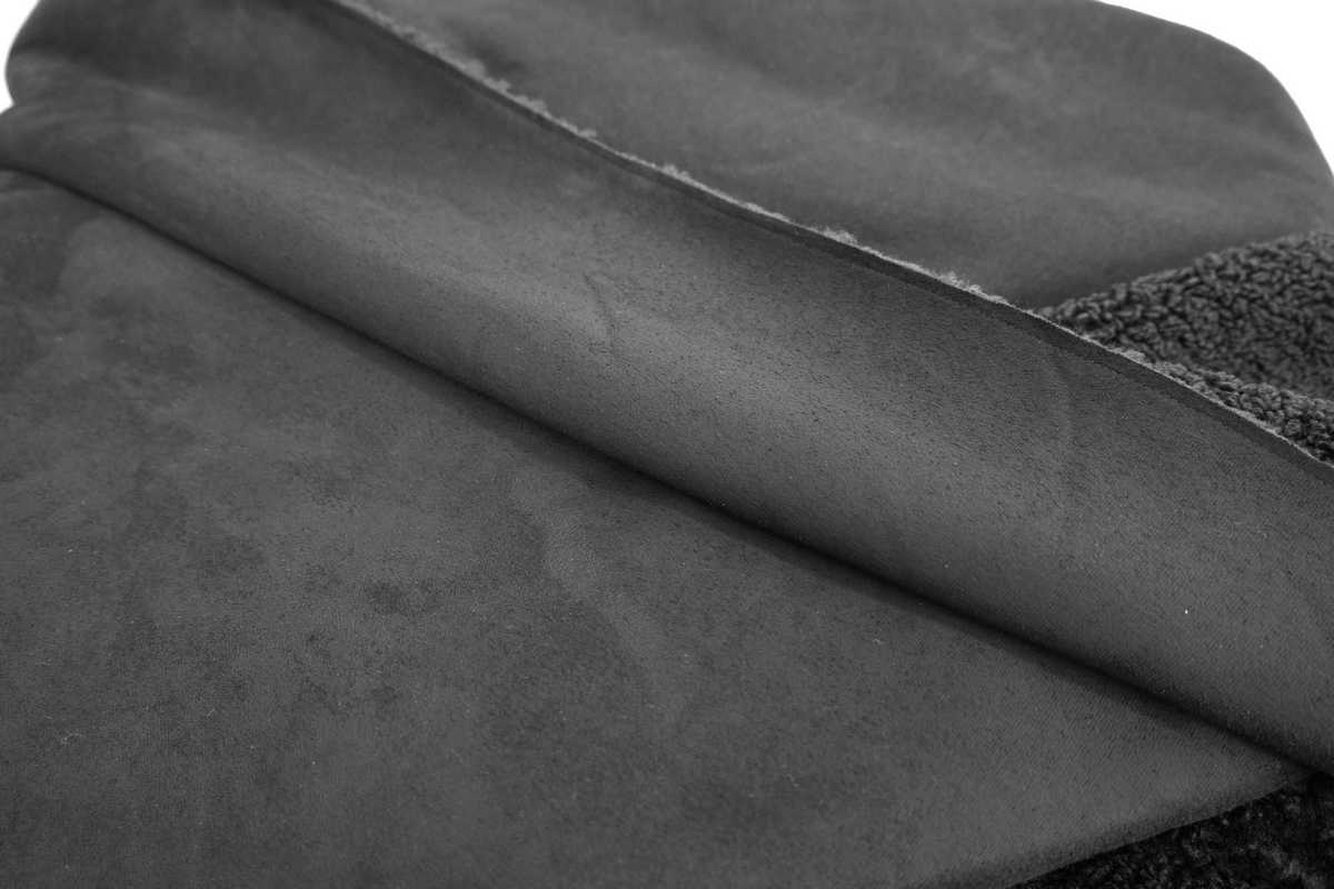 Close-up of soft black fabric showcasing the texture of a men's gothic cloak.