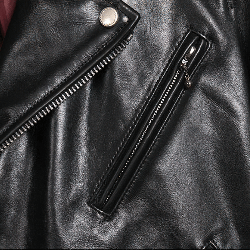 Close-up of the black waxed horsehide motorcycle jacket showcasing zippers and sleek leather texture.