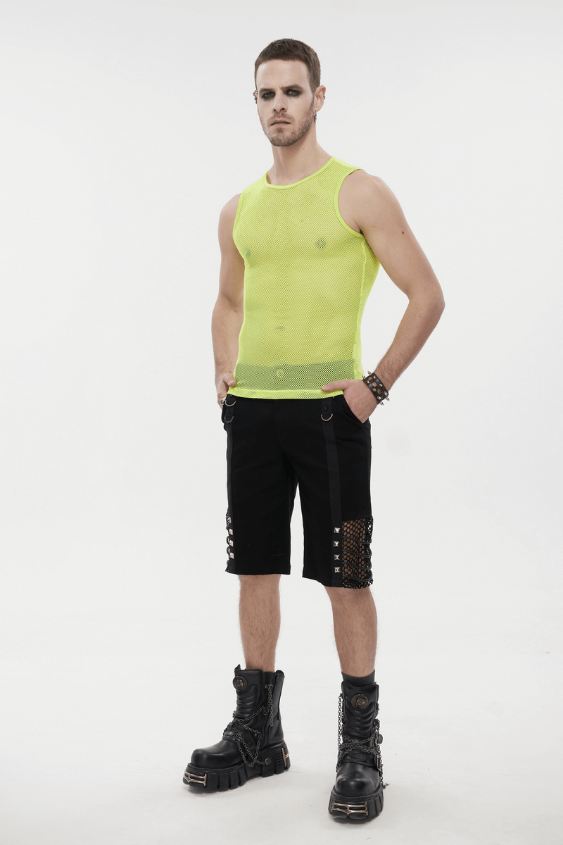 Trendy men's yellow sleeveless mesh tank top paired with black shorts and stylish boots for a bold punk look.