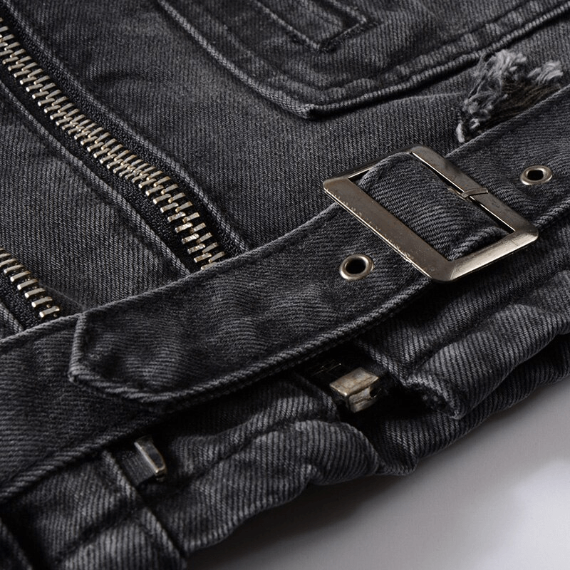 Close-up of a black denim biker jacket showcasing zippers and a belt, highlighting classic rock style details.