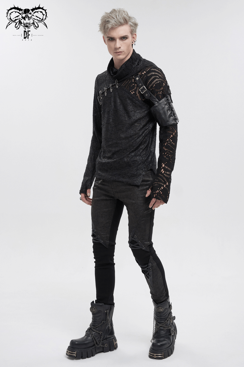 Gothic mesh asymmetrical top with pins and sleeve garter, styled with black pants and boots, perfect for edgy fashion lovers.