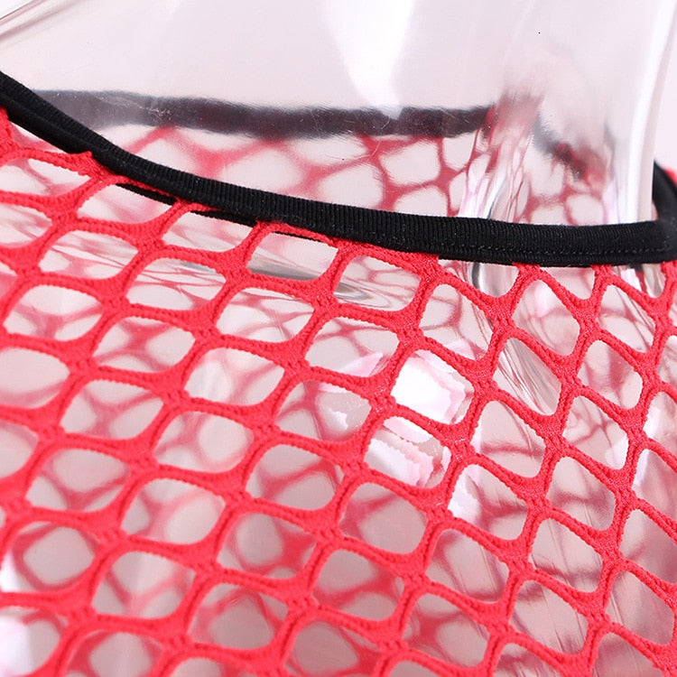 Close-up of a women's red mesh fishnet crop top with black trim, perfect for alternative and gothic styles.
