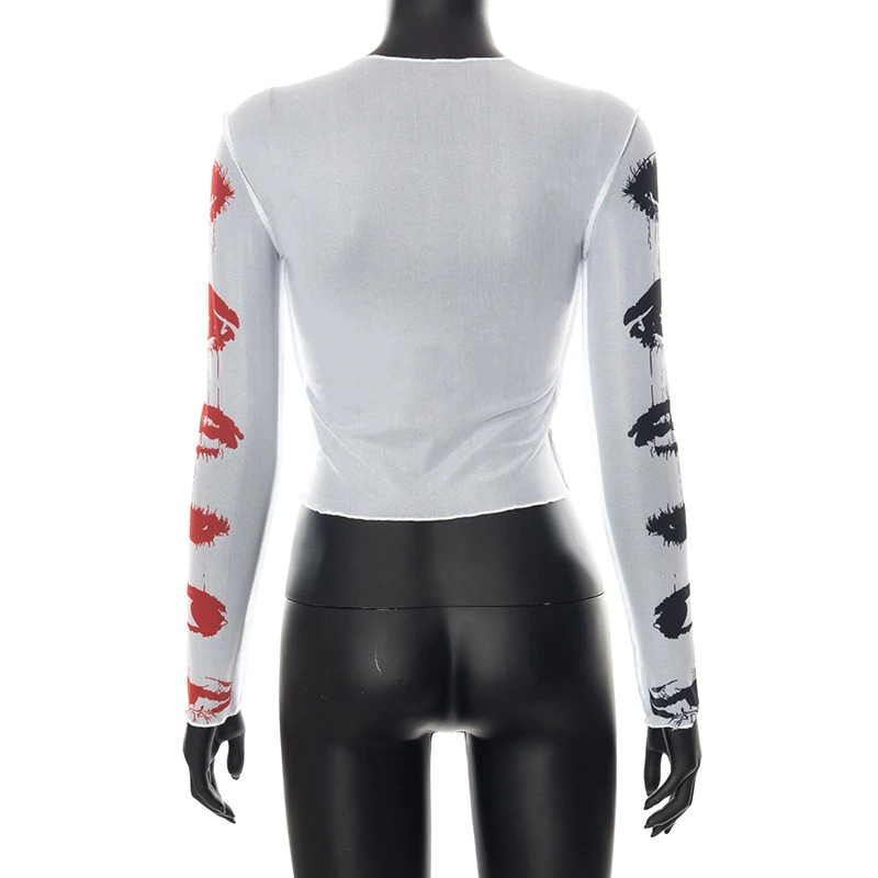 Back view of a women's mesh crop top featuring colorful lip prints on long sleeves, perfect for alternative style fashion.