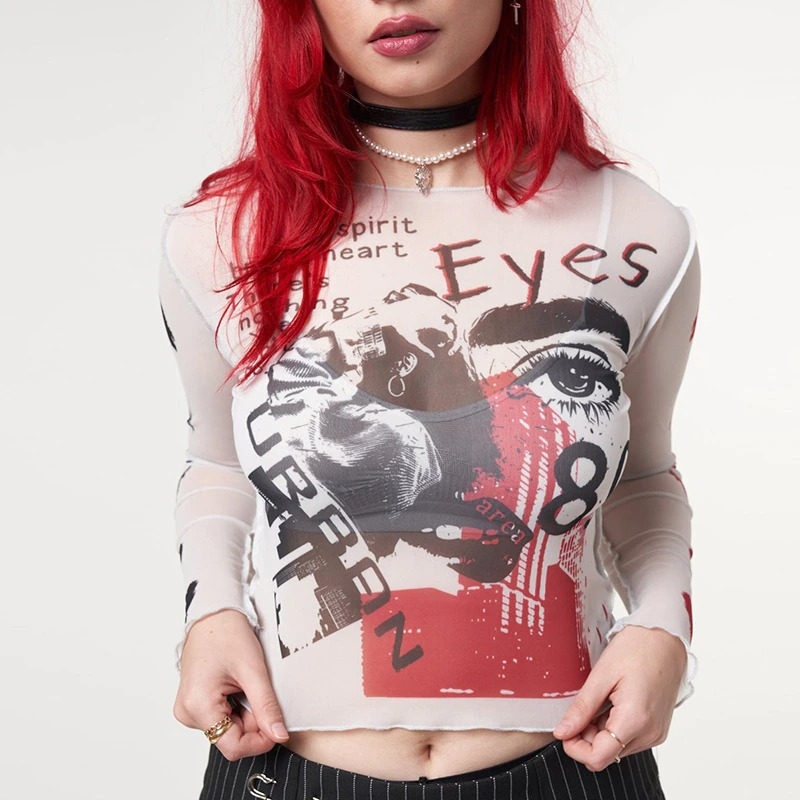 Trendy women's mesh crop top with eye-catching graphic design and long sleeves, perfect for alternative fashion lovers.