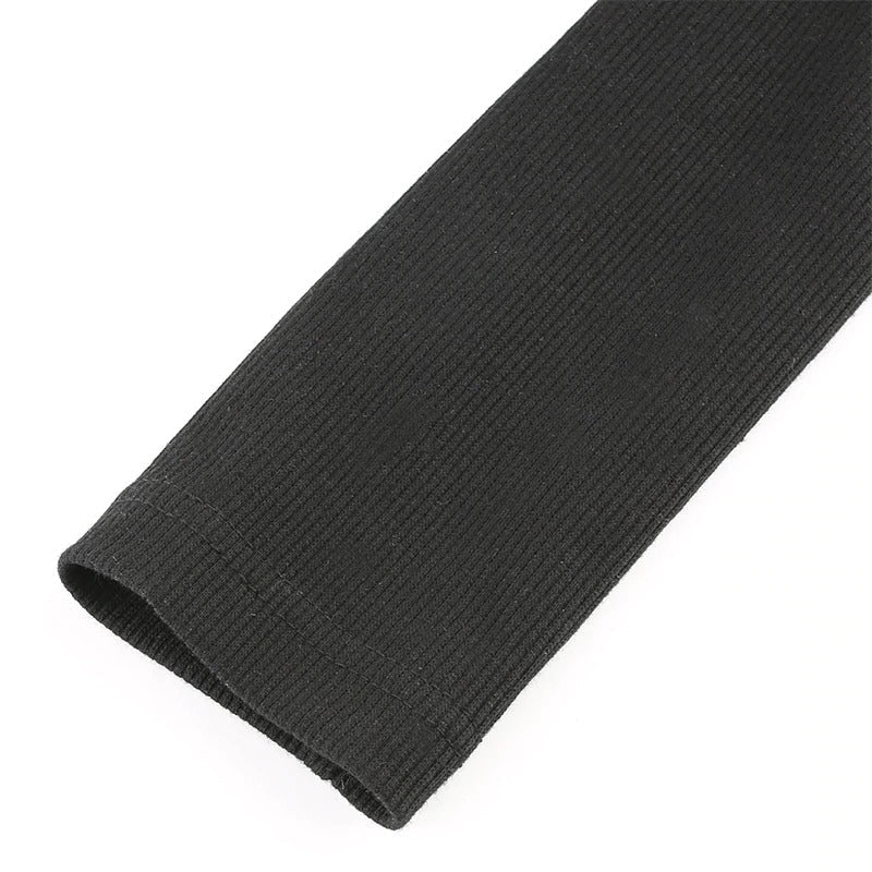 Close-up of a ribbed black sleeve, showcasing the texture of the fabric for stylish bodysuits.