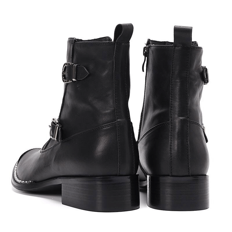 Men's black leather ankle boots with buckles, showcasing a stylish design and sturdy flat soles.