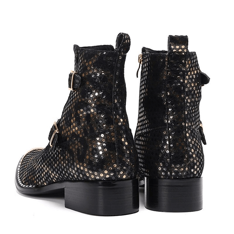 Stylish black metal pointed toe leather ankle boots with decorative buckles and a flat sole, perfect for casual wear.