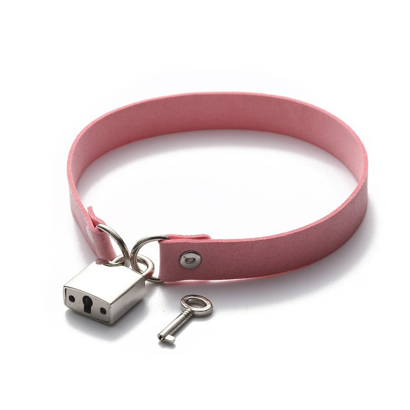 Stylish pink metallic lock choker collar necklace with key, perfect for unisex rave and rock outfits.