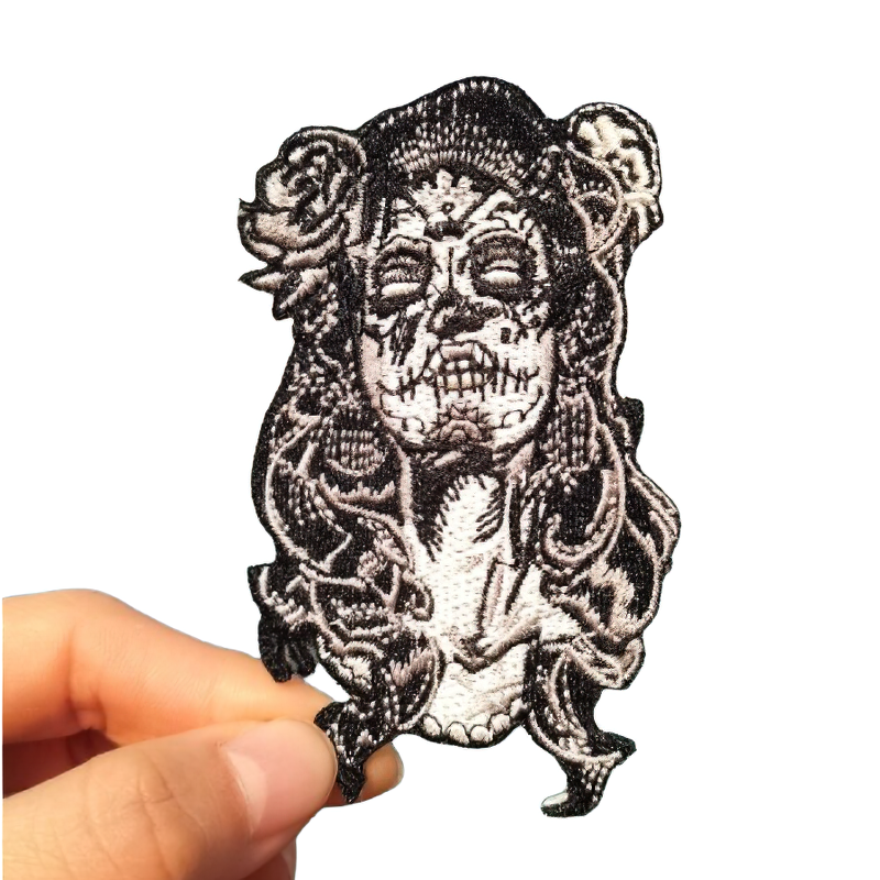Gothic embroidered Mexican Day of the Dead patch featuring a skull and roses, perfect for clothing embellishment.