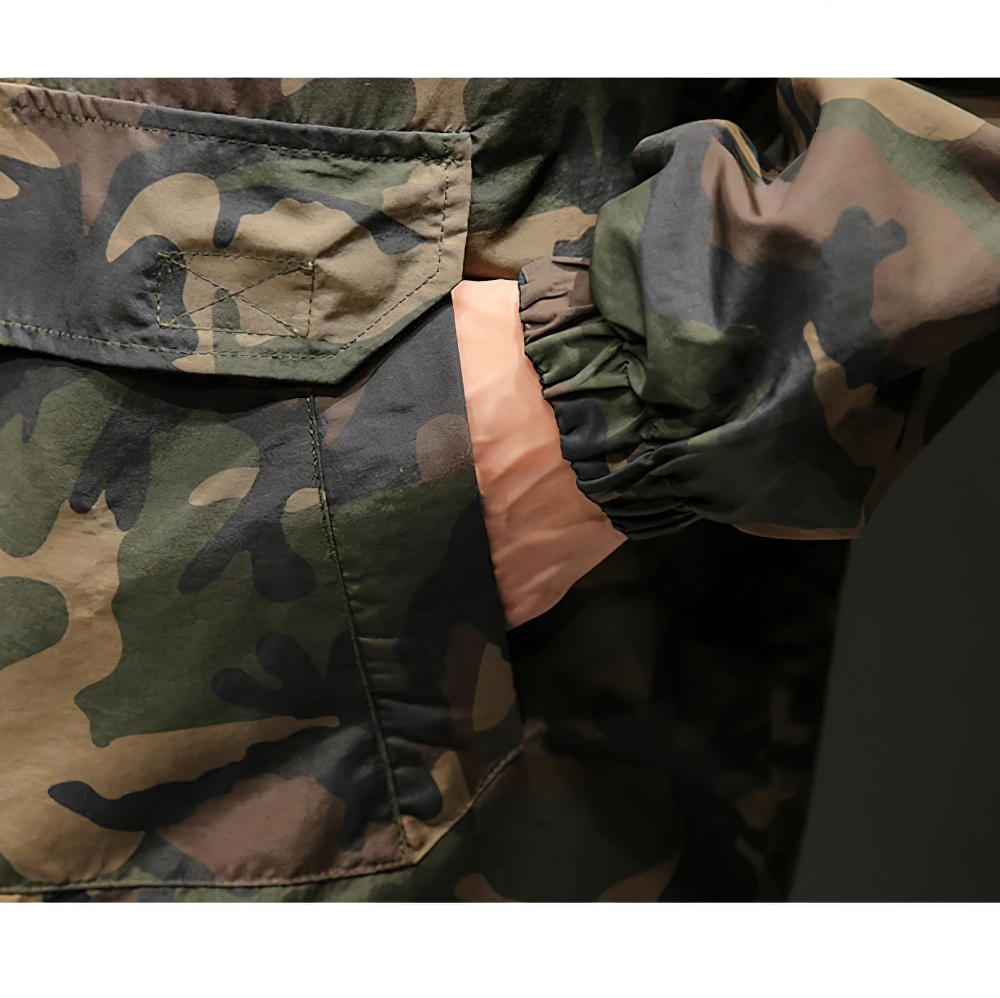 Close-up of men's military camouflage sweatshirt with hood showcasing stylish pocket detail and trendy oversized fit.