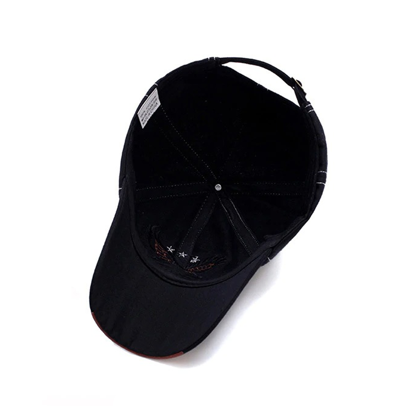 Inside view of a military cap featuring a black fabric and detailed stitching, perfect for casual rock style.