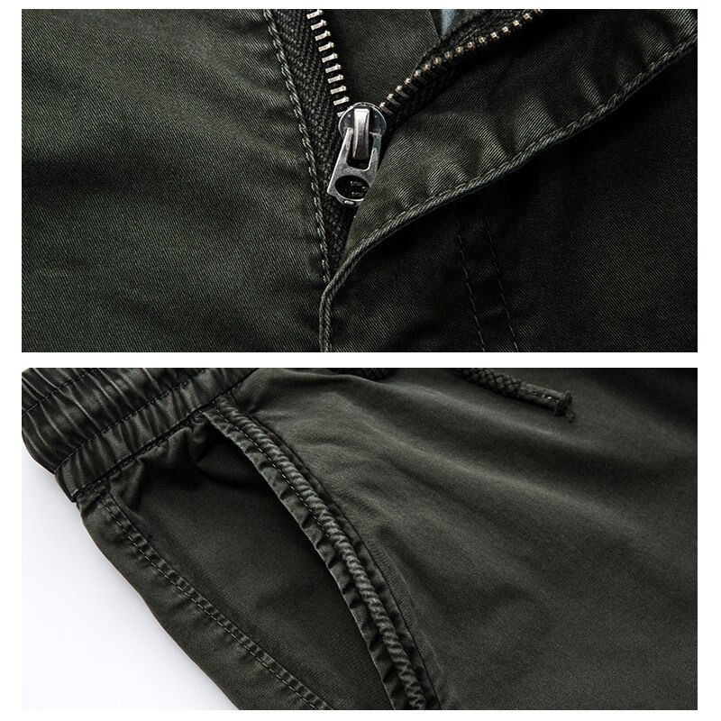 Close-up of military male jogger pants showcasing zipper and elastic waistband details for comfortable streetwear.
