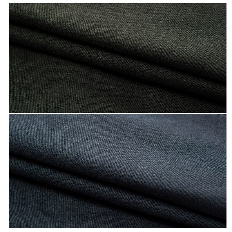 Close-up view of black and dark navy fabric textures for military male jogger pants.