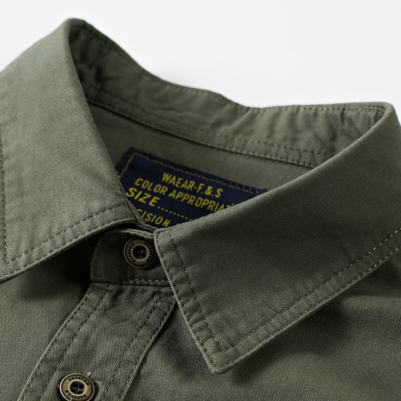 Close-up of a stylish military-style men's cotton shirt collar in olive green with label details.